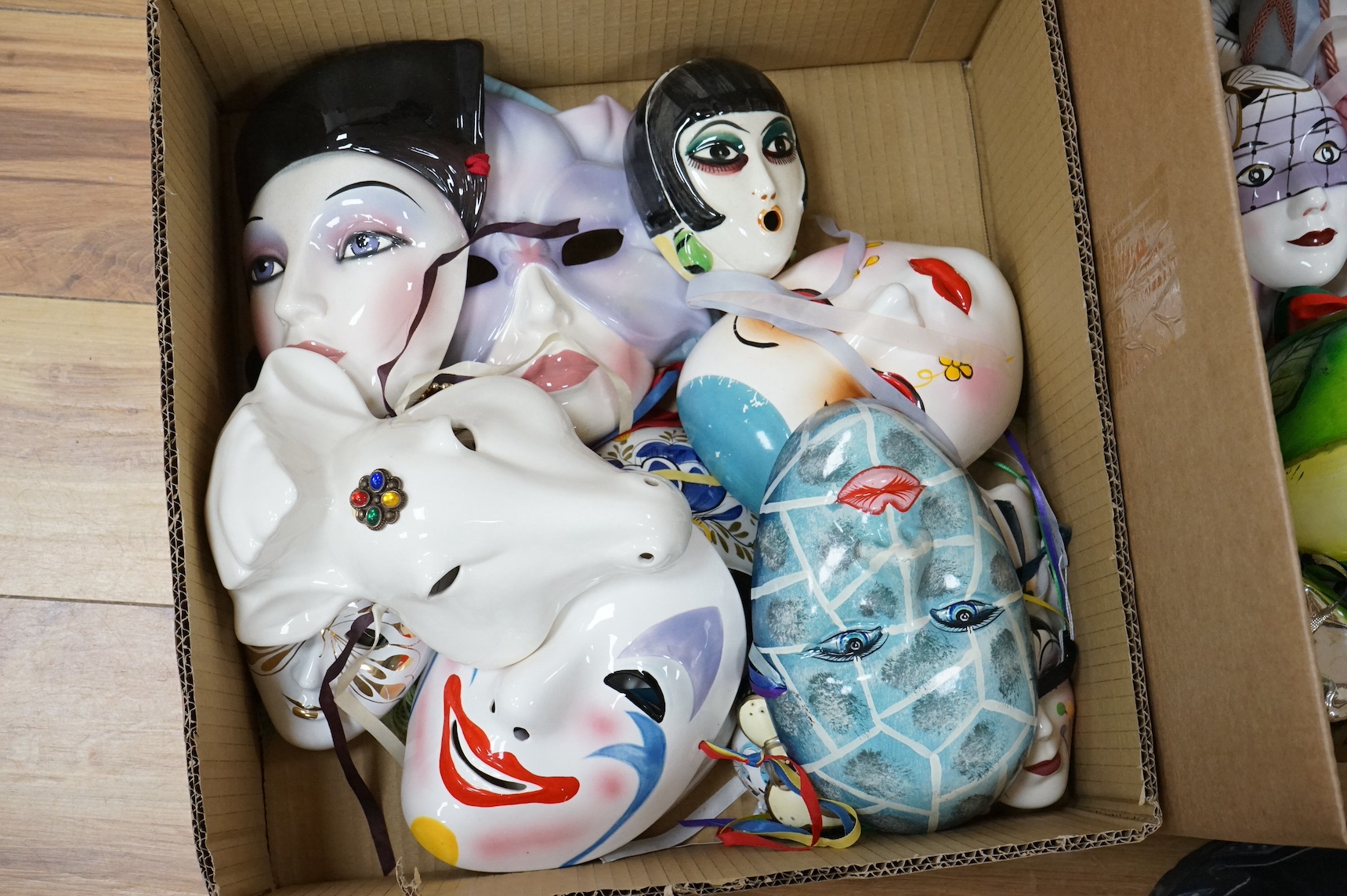 A large collection of various painted wall masks. Condition - varies